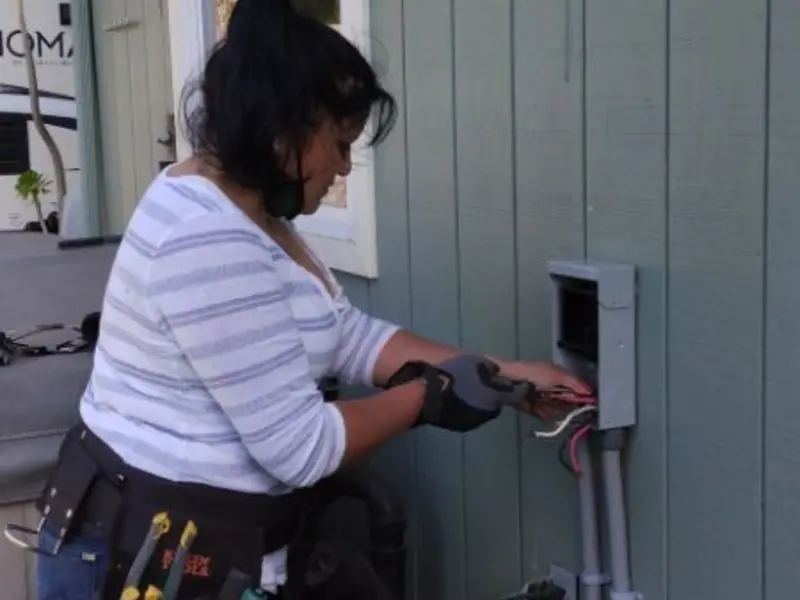 Licensed electrician wiring an exterior subpanel in Bulverde